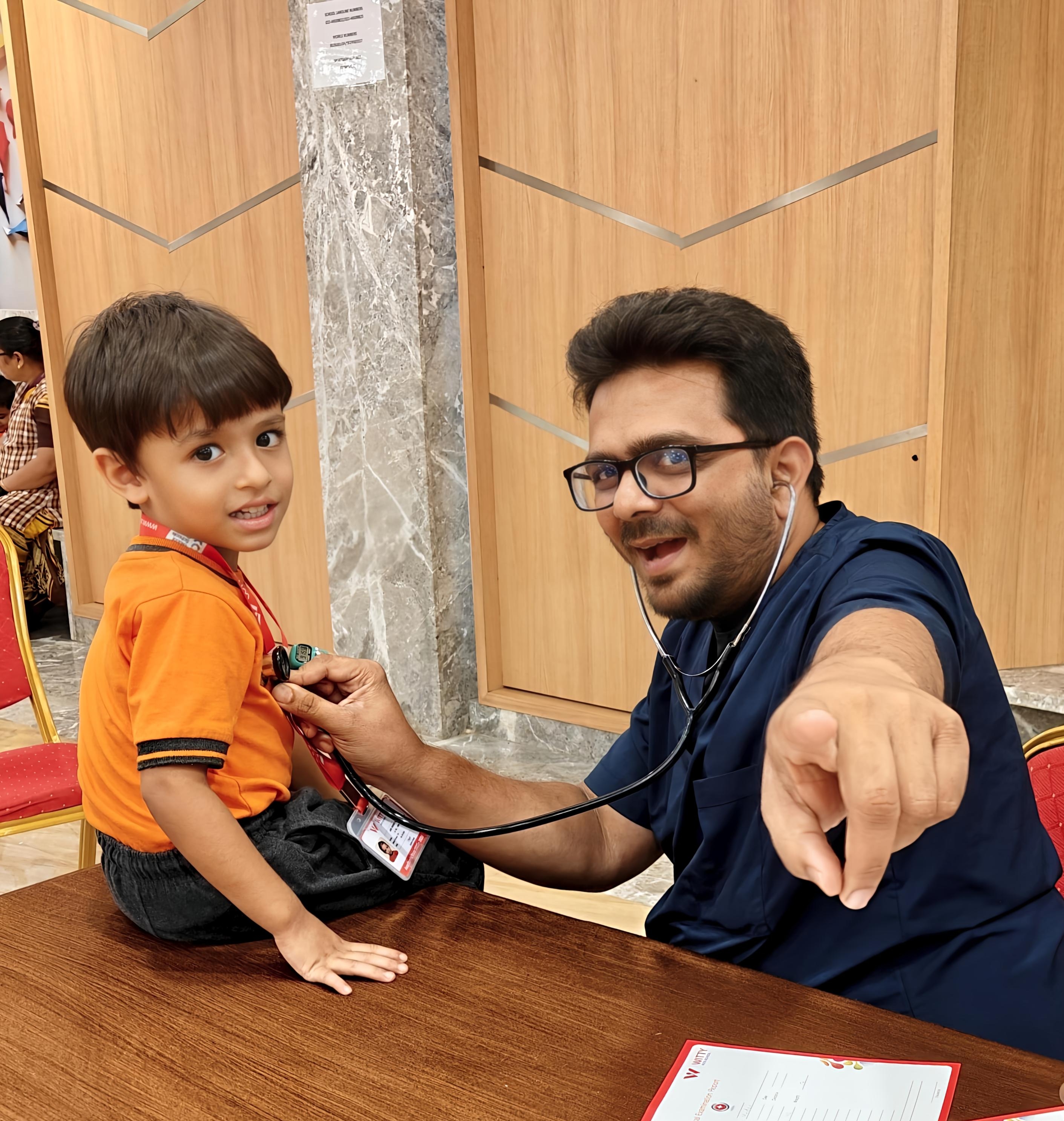 Dr Vishal Parmar Best Pediatrician checking child in Borivali Clinic